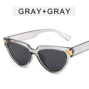 Cat-eye rivet sunglasses European and American INS triangle sunglasses women 2023 trend jelly colored glasses