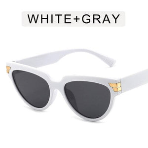 Cat-eye rivet sunglasses European and American INS triangle sunglasses women 2023 trend jelly colored glasses