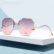 Carica l'immagine nel visualizzatore di Gallery, Ettatend 2023 Rimless Sunglasses Women Ocean Lens Metal Curved Temples Sun Glasses Vintage Shades for Female UV400