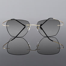 Load image into Gallery viewer, Gmei Optical Golden Titanium Alloy Men&#39;s Rimless Glasses Frame With Gradient Grey Tint Plano Lenses And Black Border Q90010