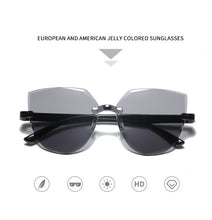Carica l&#39;immagine nel visualizzatore di Gallery, Frameless One-piece Jelly Transparent Sunglasses European and American Candy-colored Cat Eye Integrated Ocean Sunglasses